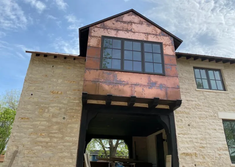 Copper metal panel facade on a stone building for Metal Roof Coating in Albuquerque